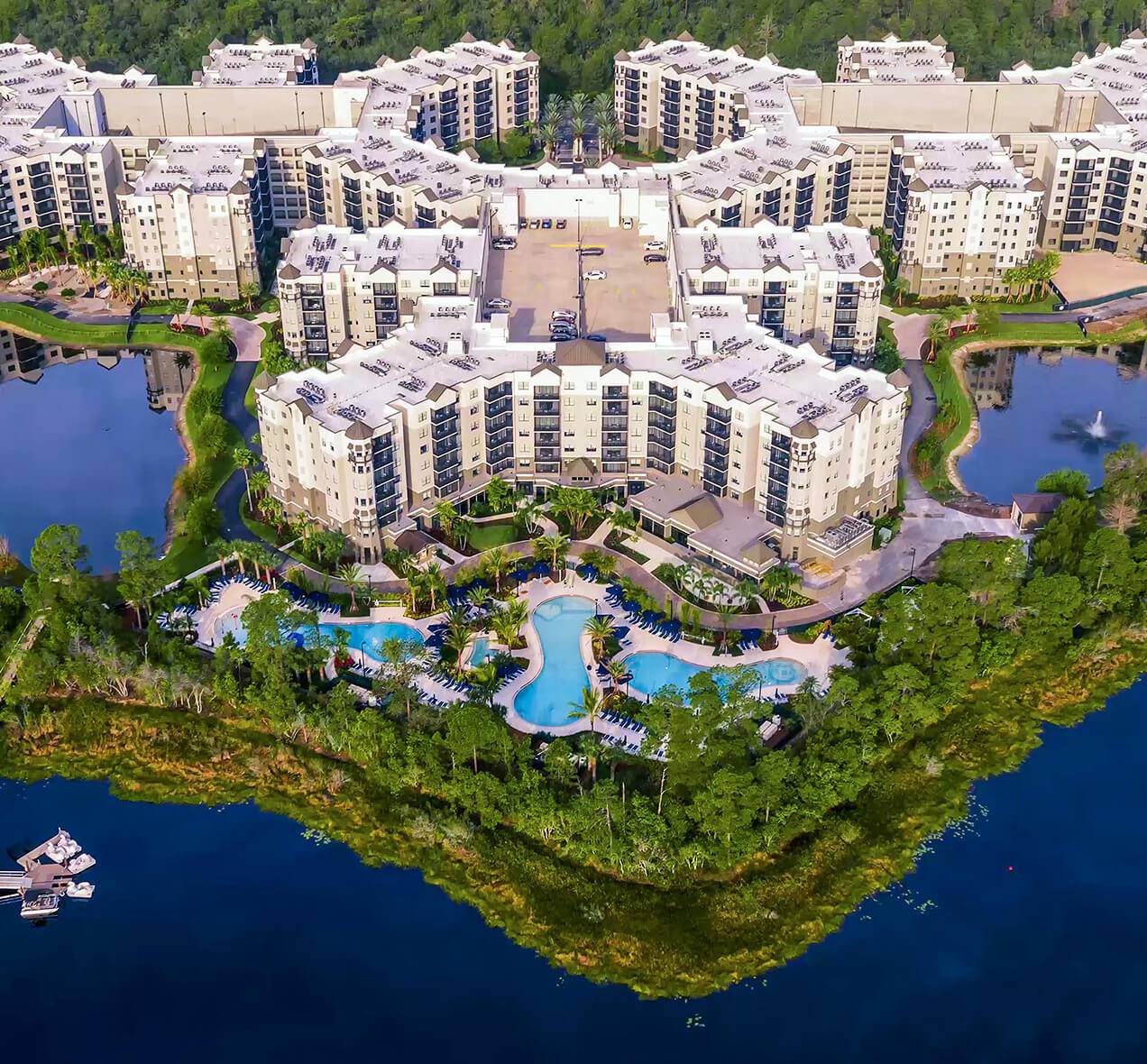 An aerial view of a hotel on the waterfront