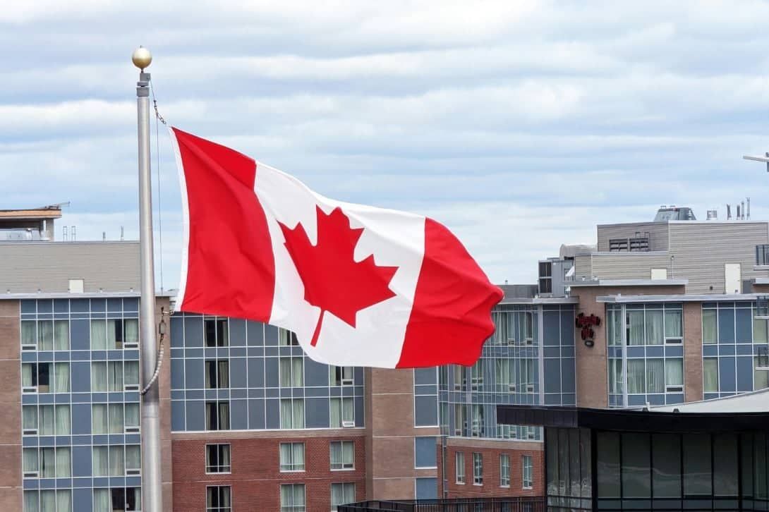 The Canadian flag on a flag pole